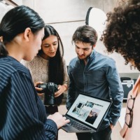 a photographer is taking a look at the pictures with models and directors - fashion stock pictures, royalty-free photos & images