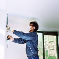 a senior man working in a home remodeling house. - home decoration stock pictures, royalty-free photos & images