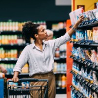a serious beautiful cuban woman shopping at the supermarket - food stock pictures, royalty-free photos & images