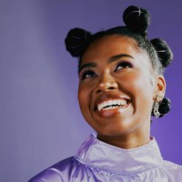 a stylish young black woman with an afro and a trendy style. portrait of an african high fashion model with a funky and retro look. a beautiful and edgy lady thinking of happy and fun times - fashion stock pictures, royalty-f