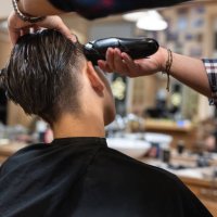a teenager getting a haircut at the hairdresser's - hairstyle stock pictures, royalty-free photos & images