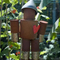 a tin man hanging in a garden - garden decoration stock pictures, royalty-free photos & images