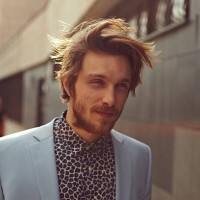 a trendy man walking city streets - fashion stock pictures, royalty-free photos & images