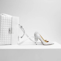 a white bag with white shoes in the form of cinderella's coach - fashion stock pictures, royalty-free photos & images