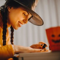 a woman paints her nails for halloween - nails art stock pictures, royalty-free photos & images
