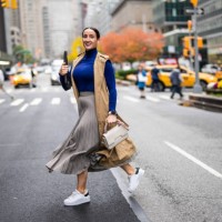 a woman seen crossing the street in new york during a busy work day - fashion stock pictures, royalty-free photos & images