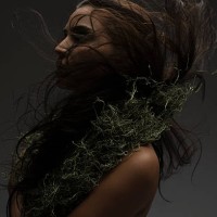 a woman wearing a moss necklace - fashion stock pictures, royalty-free photos & images