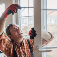 a worker installs windows - home decoration stock pictures, royalty-free photos & images