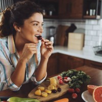 a young smiling woman having healthy breakfast in the morning - food stock pictures, royalty-free photos & images