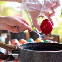 a young woman paints eggs for easter in a cottage in the forest. - garden decoration stock pictures, royalty-free photos & images