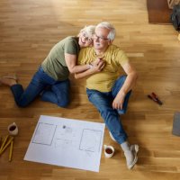 above view of happy senior couple relaxing during home relocation. - home decoration stock pictures, royalty-free photos & images