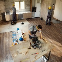 above view of manual workers working on home renovation process. - home decoration stock pictures, royalty-free photos & images