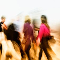 abstract image of motion blurred colorful dressed people walking fast - fashion stock pictures, royalty-free photos & images