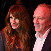 Actress Julia Roberts speaks with French owner of luxury group Kering, Francois-Henri Pinault before the start of Gucci fashion show during the Milan...