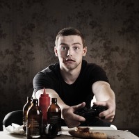 addicted gamer - junk food stockfoto's en -beelden