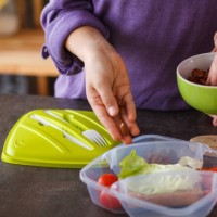 adding healthy seeds for vegetarian snack - junk food stock pictures, royalty-free photos & images