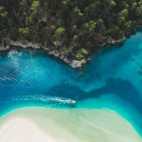 aerial drone view of oludeniz blue lagoon with turquoise sea, paradise white sand beach and tourist boat - travel stock pictures, royalty-free photos & images
