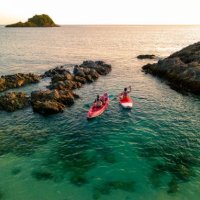 aerial view - two women enjoy the water aqua sport on the seaside. - travel stock pictures, royalty-free photos & images