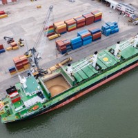 aerial view of a large cargo ship loading grain. - food stock pictures, royalty-free photos & images
