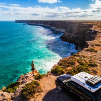 aerial view of car parked with camper and young man overlooking the great australian bight - travel stock pictures, royalty-free photos & images
