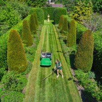 aerial view of woman working in big garden with lawn - garden decoration stock pictures, royalty-free photos & images