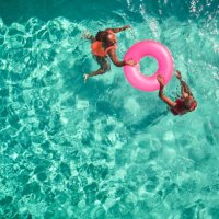 aerial view point of mother and daughter swimming together. - travel stock pictures, royalty-free photos & images