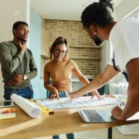 african american couple talking to manual worker during renovation process. - home decoration stock pictures, royalty-free photos & images