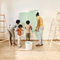 african american family painting walls in their apartment. - home decoration stock pictures, royalty-free photos & images