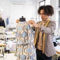 african american male tailor at work in his workshop, measuring handcrafted production of fashion clothes, concept of diversity and integration, new small social business - fashion stock pictures, royalty-free photos & imag