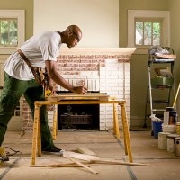 african american man renovating home interior. - home decoration stock pictures, royalty-free photos & images