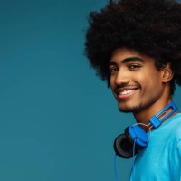 african american man with african hairstyle using phone - fashion stock pictures, royalty-free photos & images
