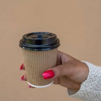 african american woman's hands holding a paper cup coffee - junk food stock pictures, royalty-free photos & images