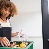 african american young woman making compost from leftovers. sustainability concept. - food stock pictures, royalty-free photos & images