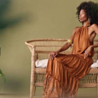 african, fashion and black woman in tropical studio design to model interior design, furniture and plants on green background. afro woman sitting on chair mockup for beauty, natural skin and wellness - fashion stock pictures,