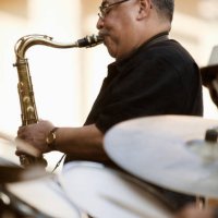 afro-columbian man playing saxophone - concert stock pictures, royalty-free photos & images