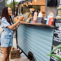 afro girl buying potato at the fast food truck - food stock pictures, royalty-free photos & images