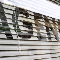 agency text on the glass window - fashion stock pictures, royalty-free photos & images