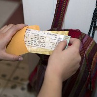 Alejandra Pinzon look at Taylor Swift tickets from a concert she attended in 2005 in the United States in her apartment in Mexico City, June 23,...