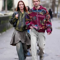 Alice Barbier wears dark green light green pattern leather jacket, dark gray over the knee skirt, black leather bag, dark gray washed slouchy denim...