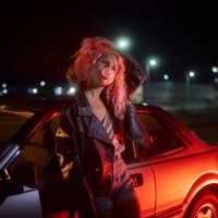 alternative young girl leaning on car with bubble gum at night - fashion stock pictures, royalty-free photos & images