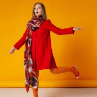 amazed woman in stylish outerwear walking in studio - fashion stock pictures, royalty-free photos & images
