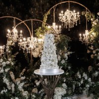 amazing wedding cake in the evening illumination - garden decoration stock pictures, royalty-free photos & images