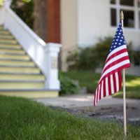 american flag in front of house - garden decoration stock pictures, royalty-free photos & images