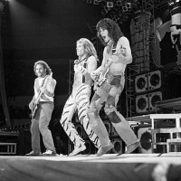 American musicians David Lee Roth, Eddie Van Halen, and Michael Anthony, of the group Van Halen, perform at Nassau Coliseum, Uniondale, New York,...