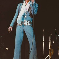 American singer Elvis Presley performing on stage, circa 1972.