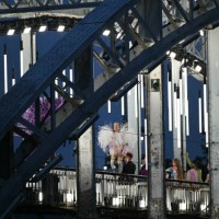An amputee fashion model displays creations while walking a catwalk erected along the Passerelle Debilly bridge on the Seine river during the opening...