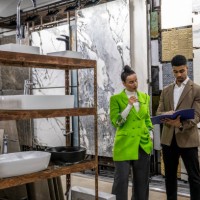 an architect and a salesman seen in luxury ceramic store - home decoration stock pictures, royalty-free photos & images