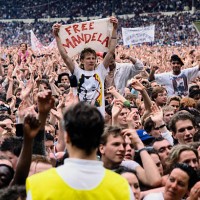 An audience member holds up a "Free Mandela" sign at the Nelson Mandela Freedom Festival at Clapham Common in London.