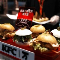 An employee prepares hamburgers at the KFC China's 10,000th store on the opening day on December 15, 2023 in Hangzhou, Zhejiang Province of China....