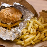 An order of a burger and french fries at the first outlet of US burger restaurant chain Five Guys in the Gangnam District of Seoul, South Korea, on...